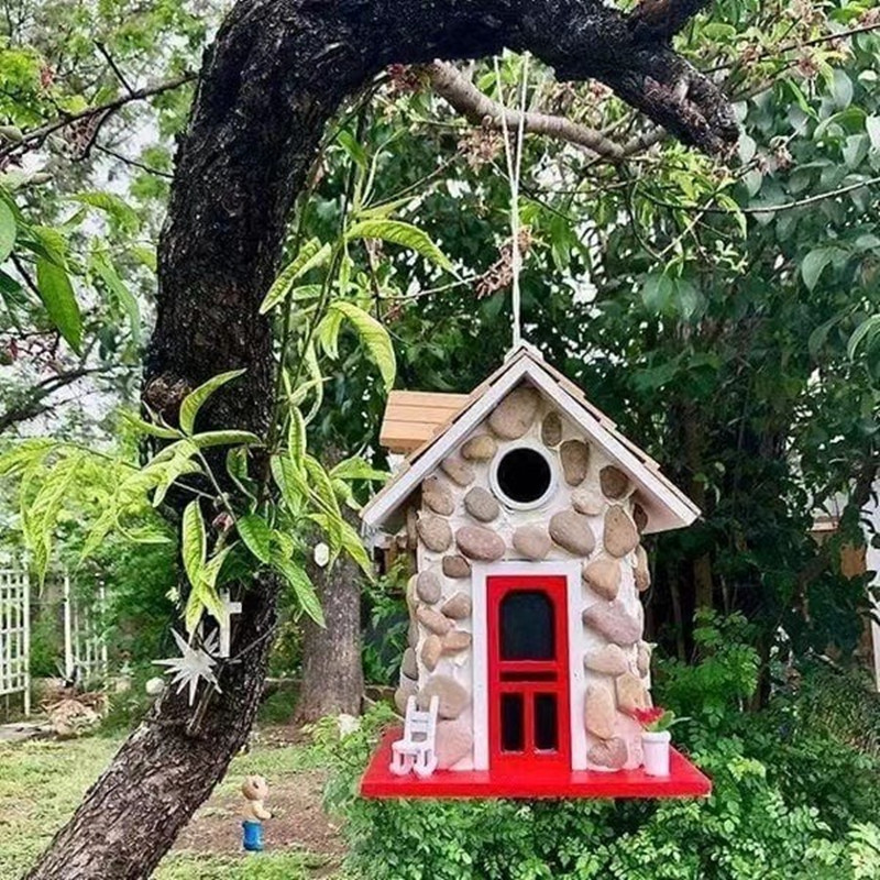 Decorative stone-look birdhouse made of resin
