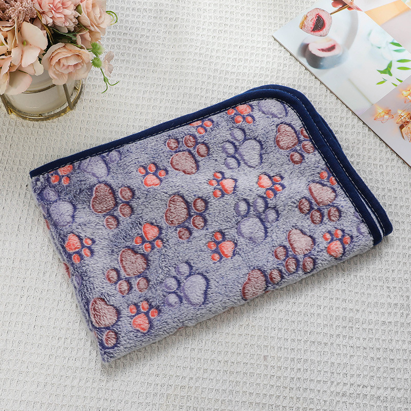 Fleece pet mat with paw and bone pattern