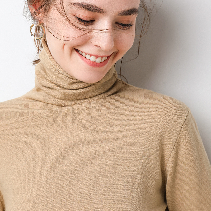 Women's knit sweater with standing collar and geometric pattern