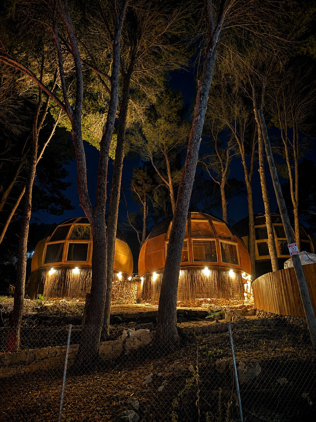 AUMARA geodesic houses among trees