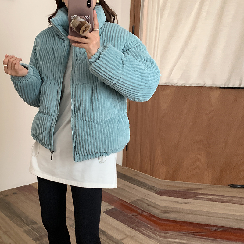 Short women's winter jacket made of corduroy with stand-up collar