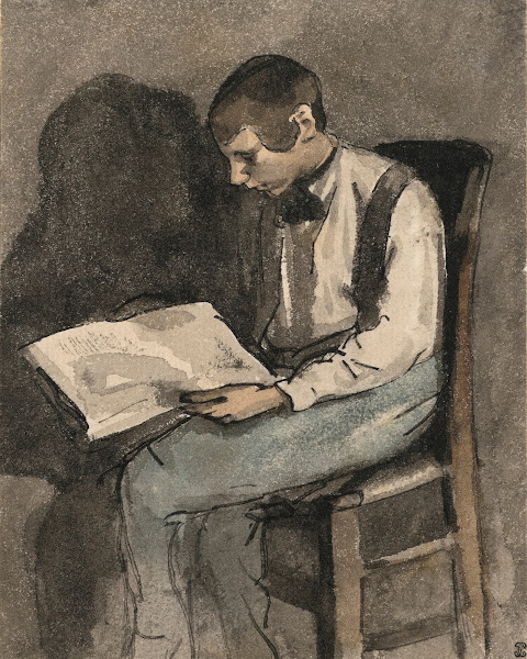 Jeune homme assis lisant