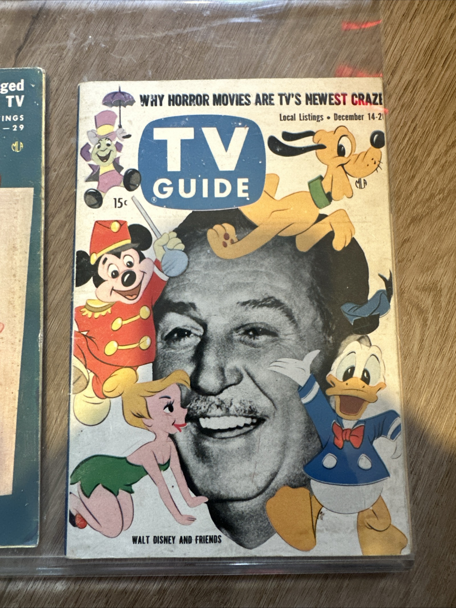 TV Guide December 14–20, 1957 cover featuring a black-and-white portrait of Walt Disney surrounded by color illustrations of Mickey Mouse, Donald Duck, Pluto, Tinker Bell, and Jiminy Cricket