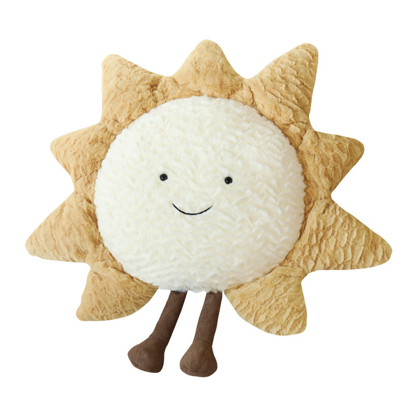 Decorative cuddle pillows with moon, star, and sun motif