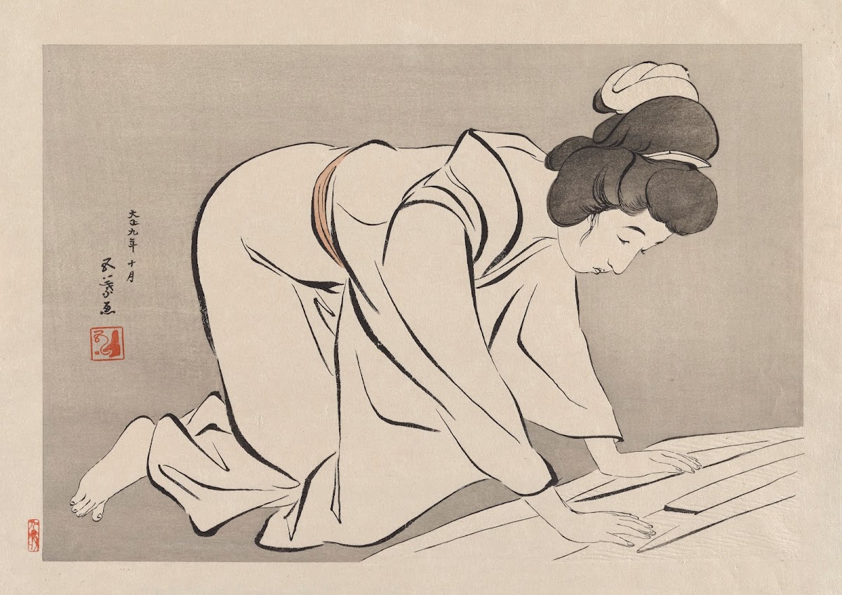Woman folding a kimono