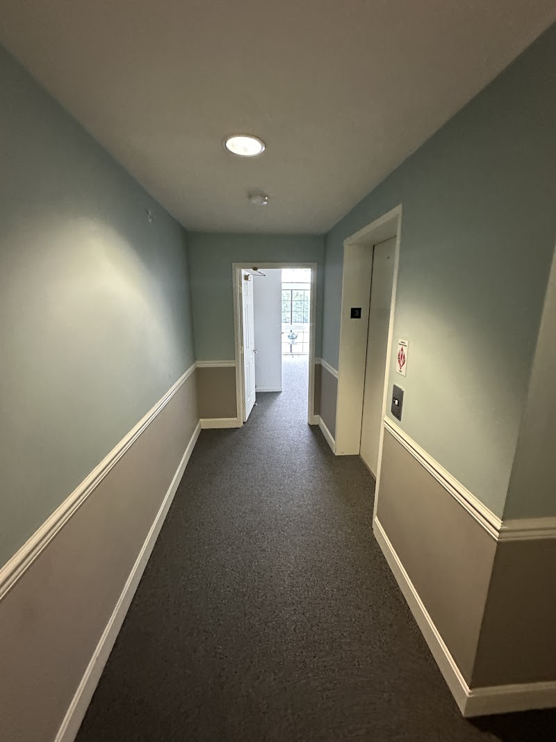 Yardley Court corridor before repaint, scuffed walls and trim