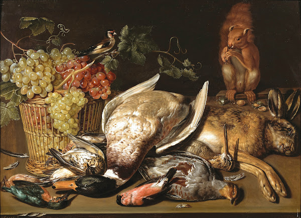 A basket of red and green grapes a goldfinch game and a squirrel on a wooden tab