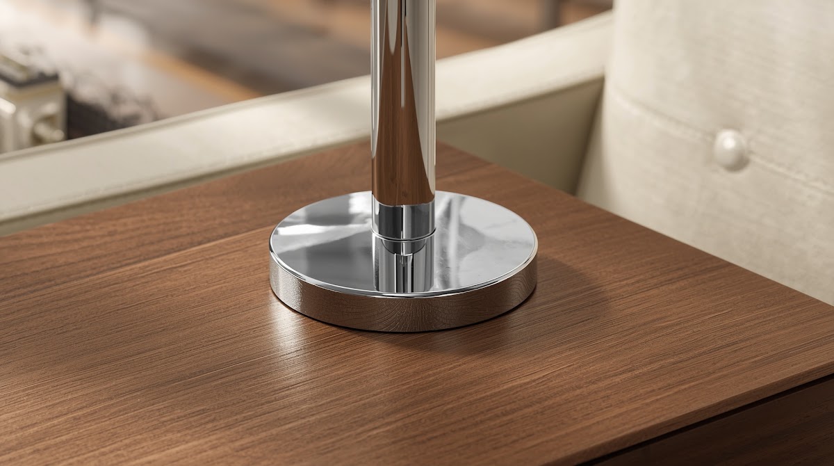 How to Make Chrome Home Office Accessories Work With a Wood Desk - chrome detail beside warm wood grain and textured fabric