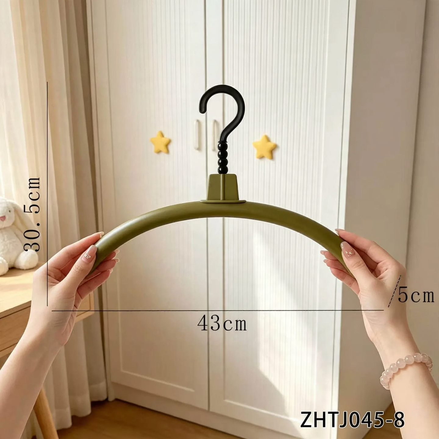 Plastic hanger with non-slip surface