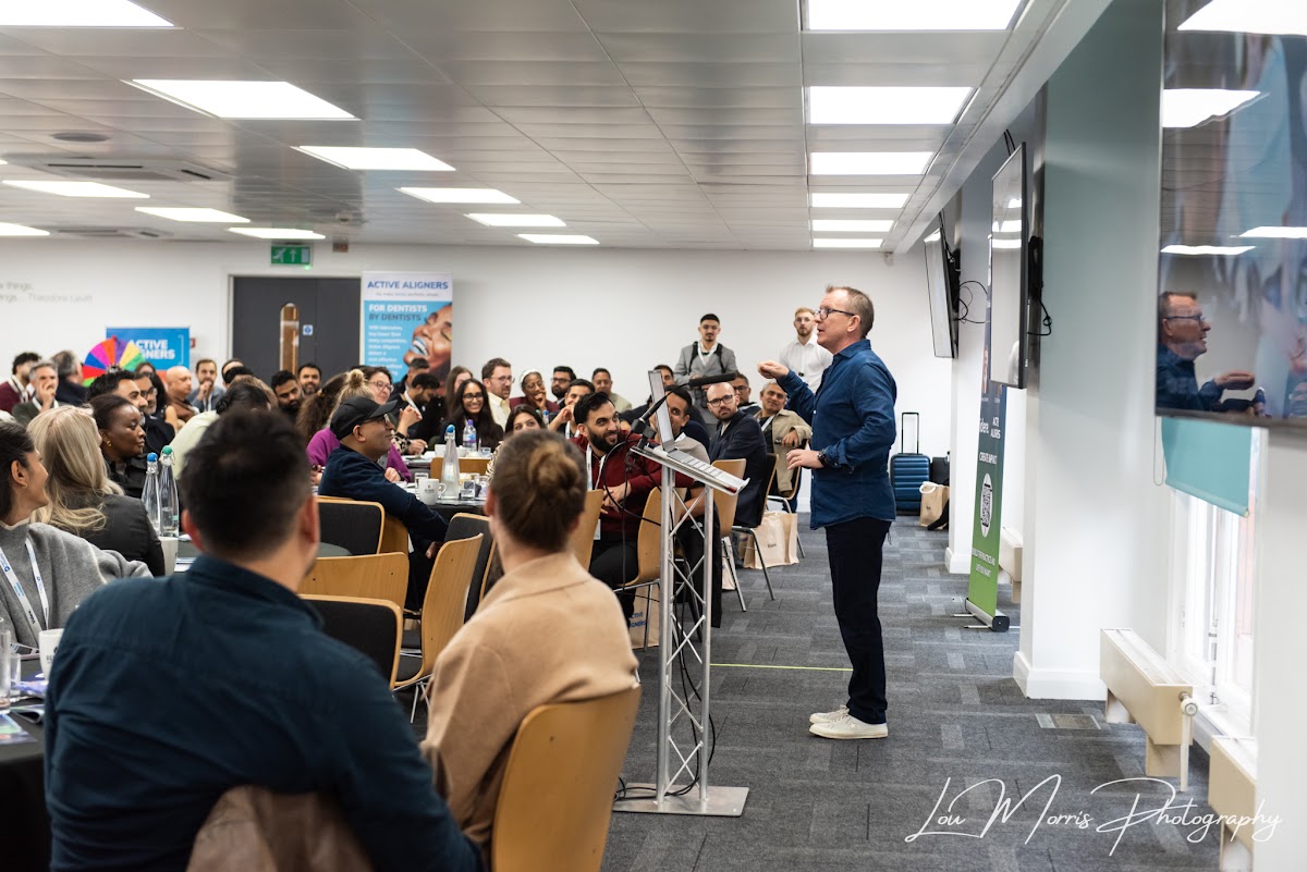 Dr. Barry Oulton addressing a full room of dentists