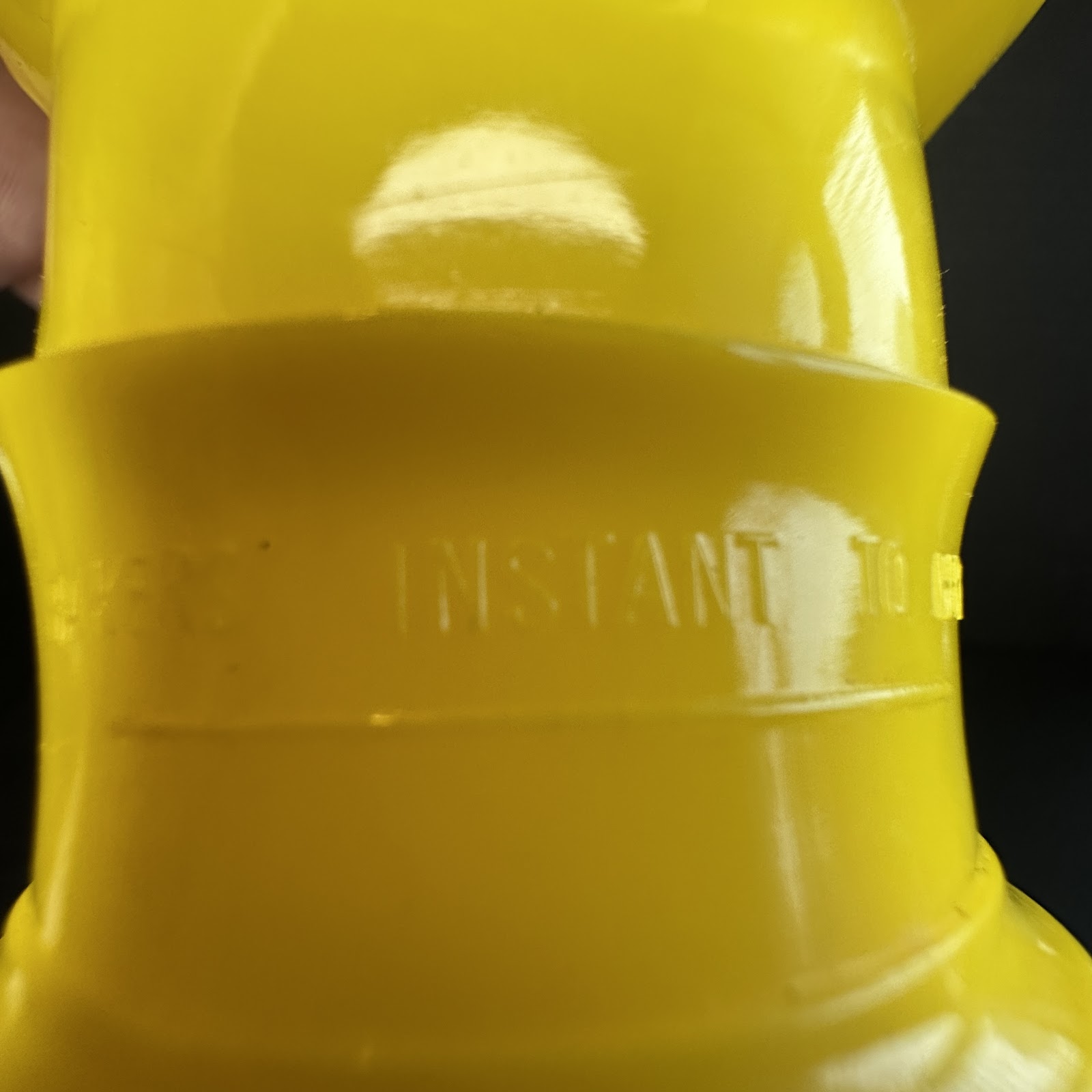Vintage Sun Rubber Co. Pluto squeak toy, yellow soft vinyl figure in standing pose with molded black collar and painted nose, 1950s–1960s