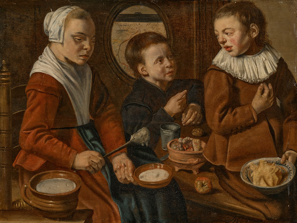 Three children in a kitchen interior