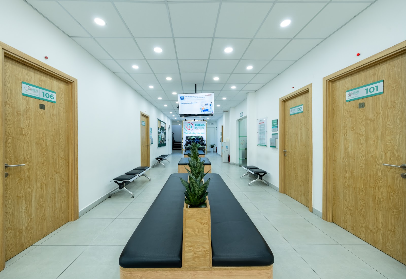 Reception area of a modern medical facility with minimalist wood and white interior design, clean layout, and bright background. 3D Rendering