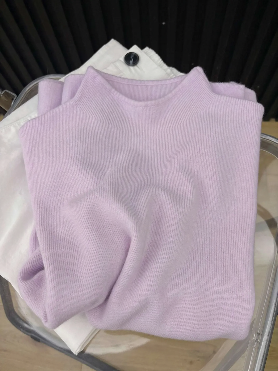 Women's knitted sweater with a small stand-up collar