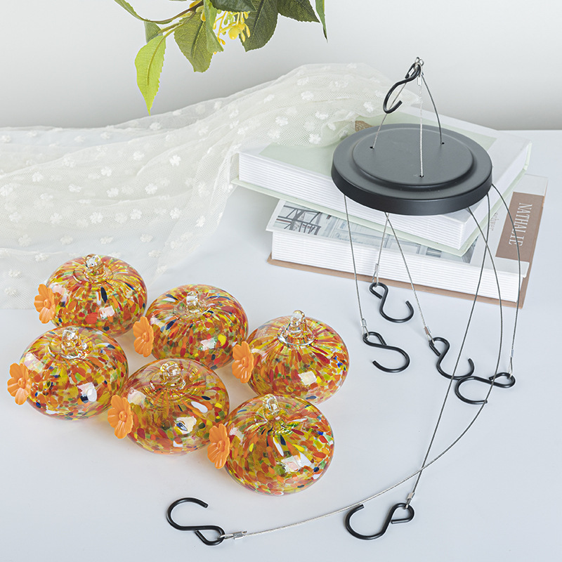 Hanging bird feeder and water station made of glass