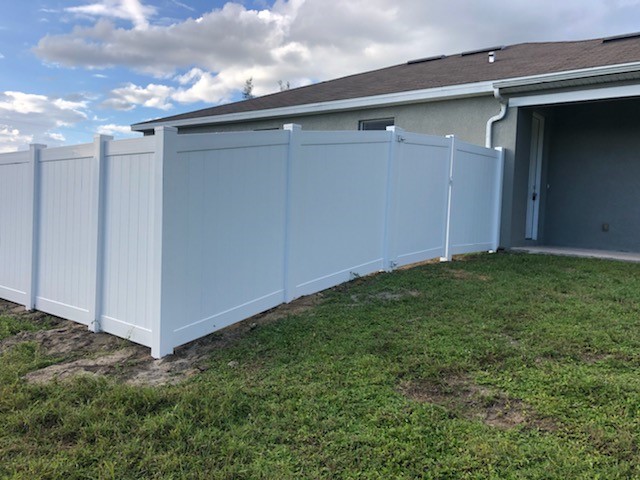 White vinyl privacy fence installation Cape Coral Naples Florida — Premier Fence of SWFL