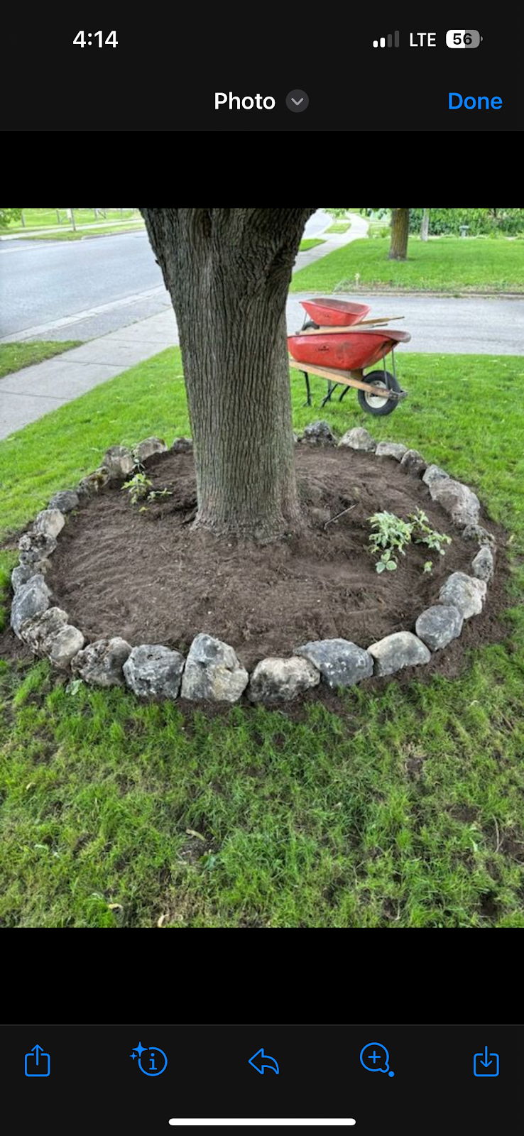 Custom outdoor stone fire pit and seating wall in London, Ontario