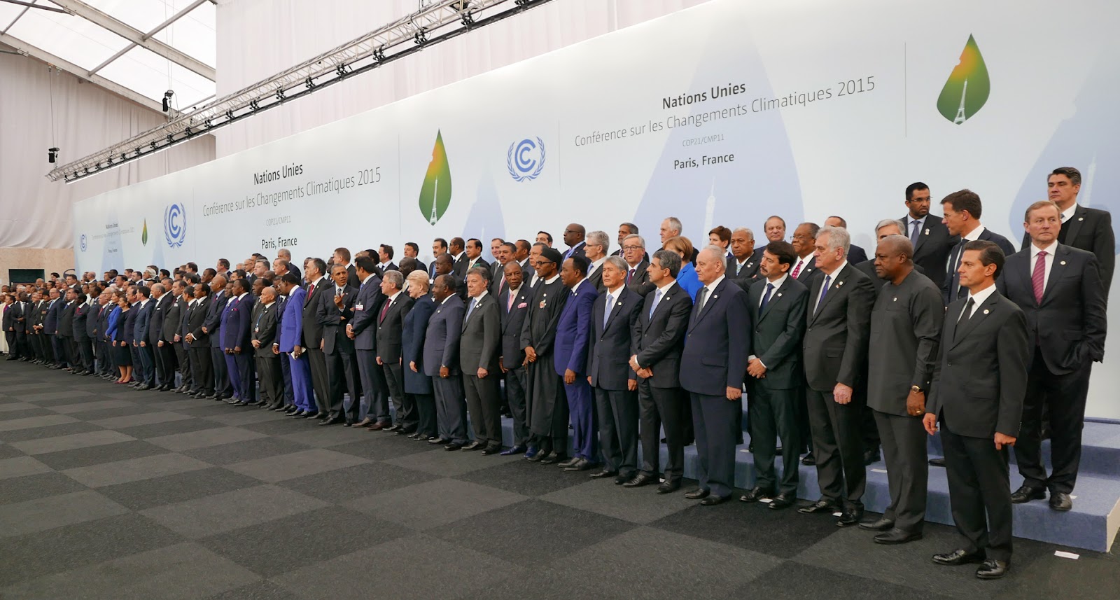 Delegations at COP21 standing in lines in suits