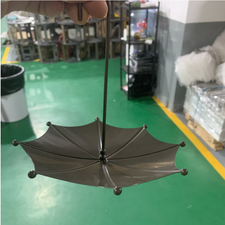 Iron bird bath in umbrella shape