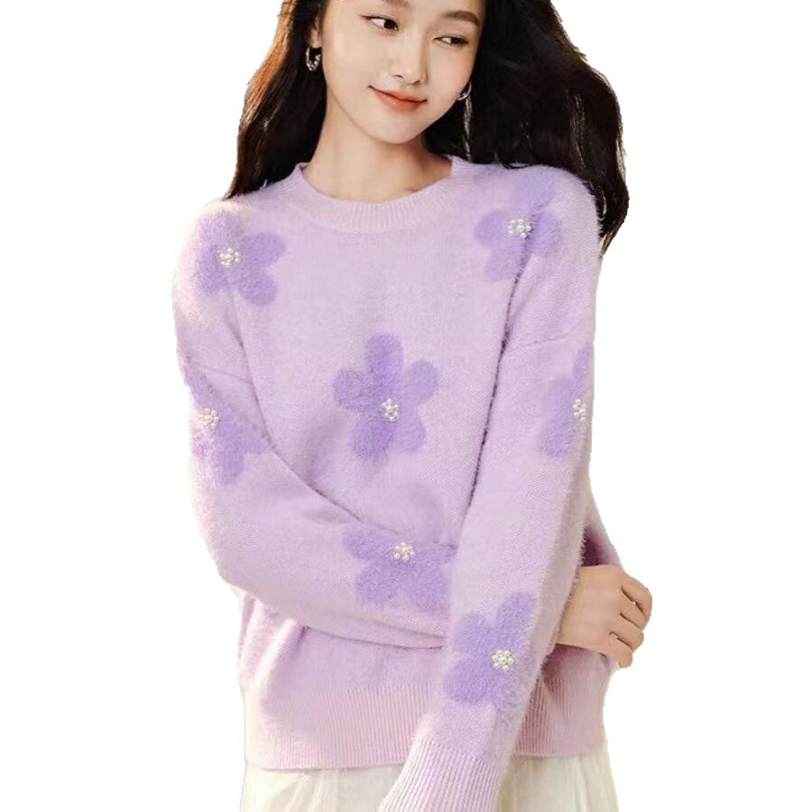 Women's knitted sweater with floral pattern and pearl embellishment