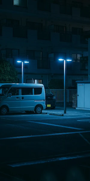 Night Van Under Blue Lights 2K iPhone Wallpaper Background