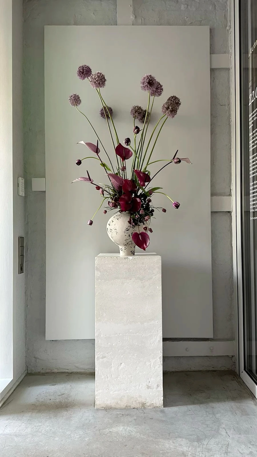Purple Floral Arrangement On Pedestal - Minimalist Interior Photography Full HD iPhone Wallpaper (1080x1920)