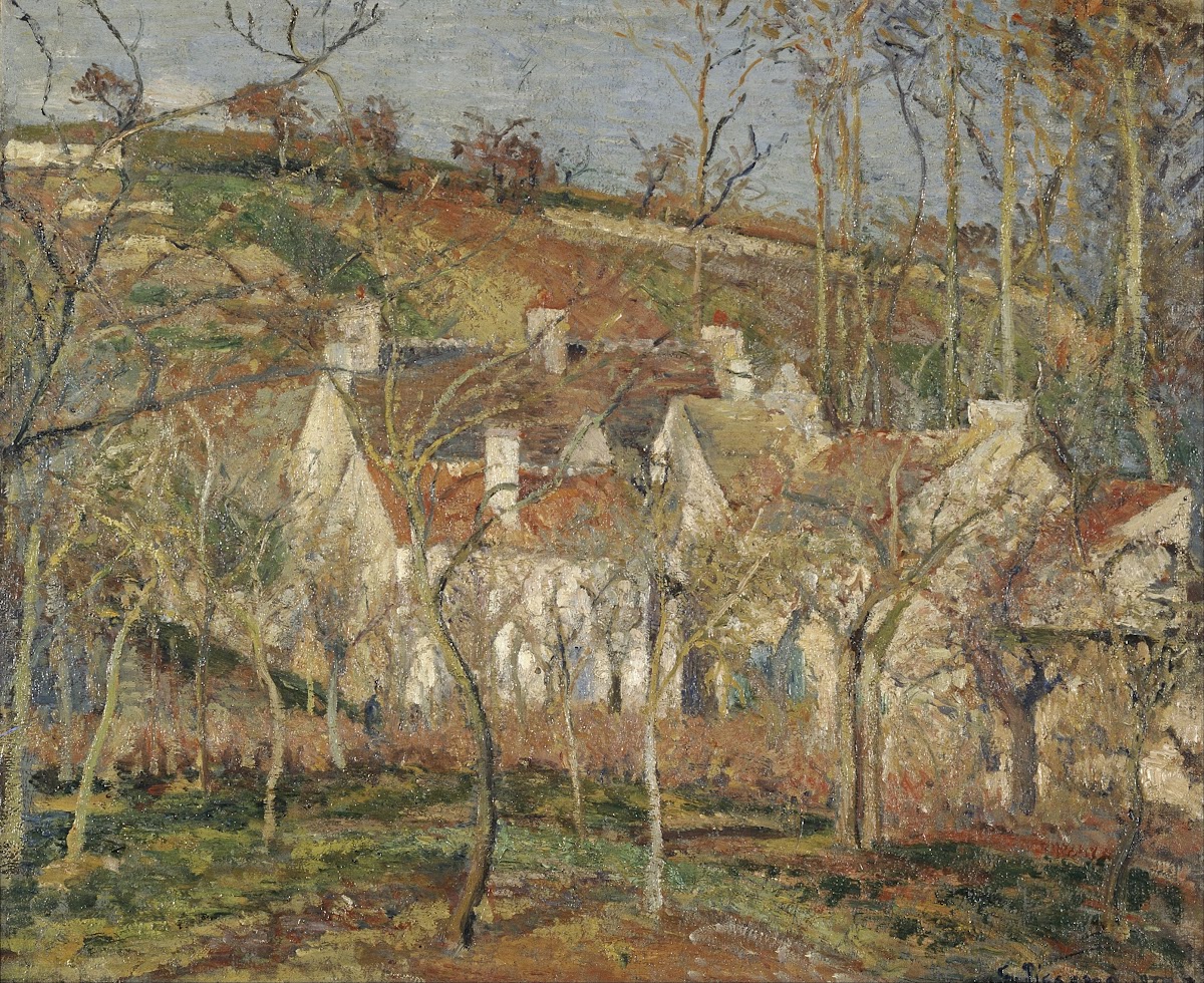 Red roofs corner of a village winter