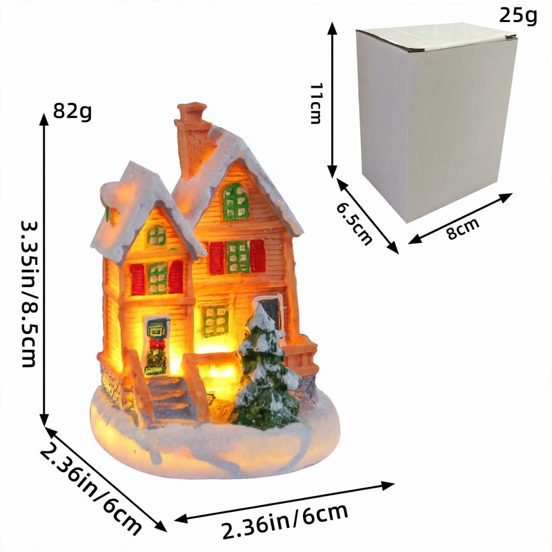 Beleuchtetes Miniatur-Weihnachtshaus mit Schneelandschaft