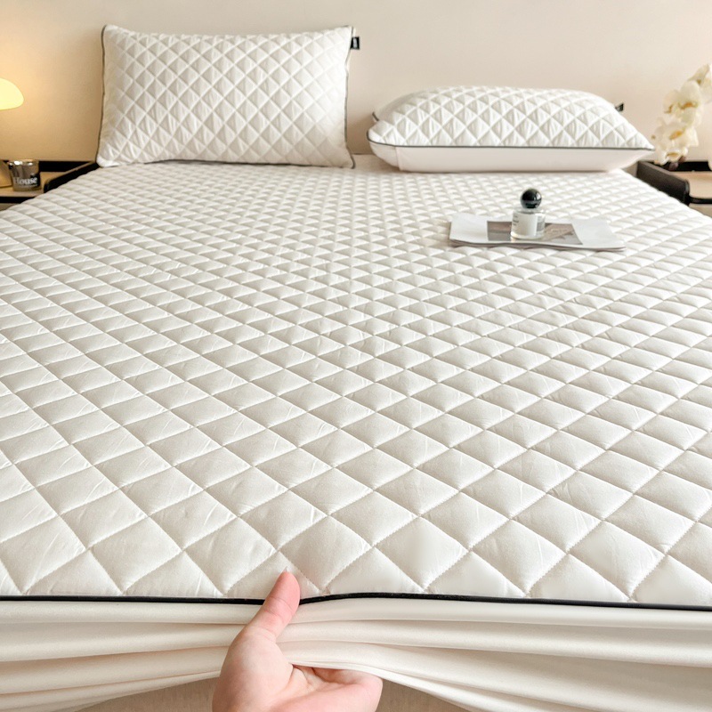 Quilted fitted cover with slip protection
