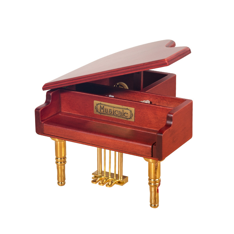Wooden music box in the shape of a piano with metal feet