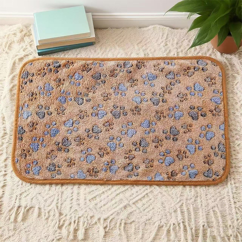 Fleece pet mat, paw and bone pattern