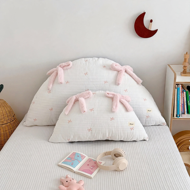Cotton pillow with bow pattern