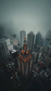 Misty City Skyline with Illuminated Skyscraper Tower