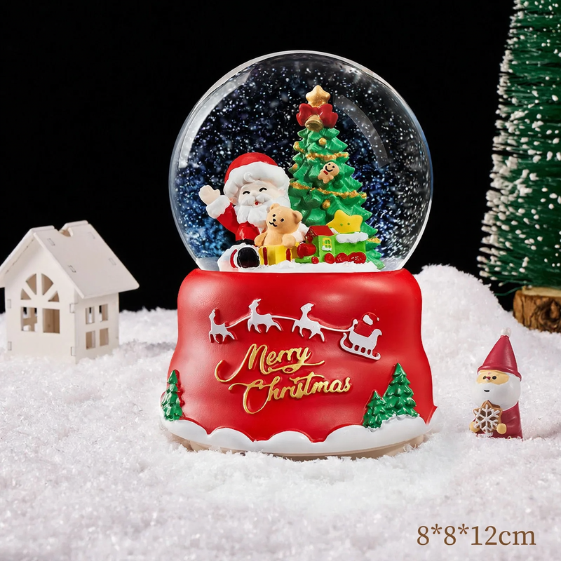 Christmas snow globe with music box and carriage design