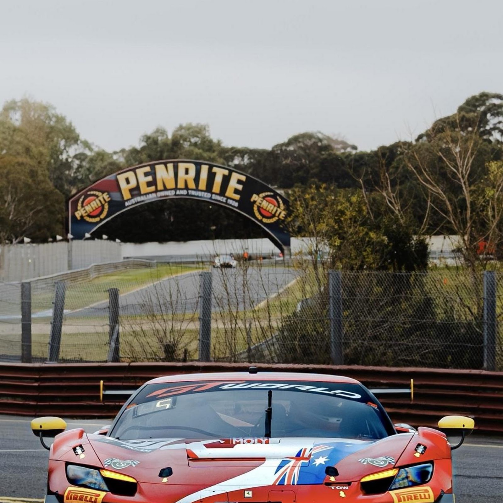 Download Red Race Car On Paddock Road Full HD iPhone