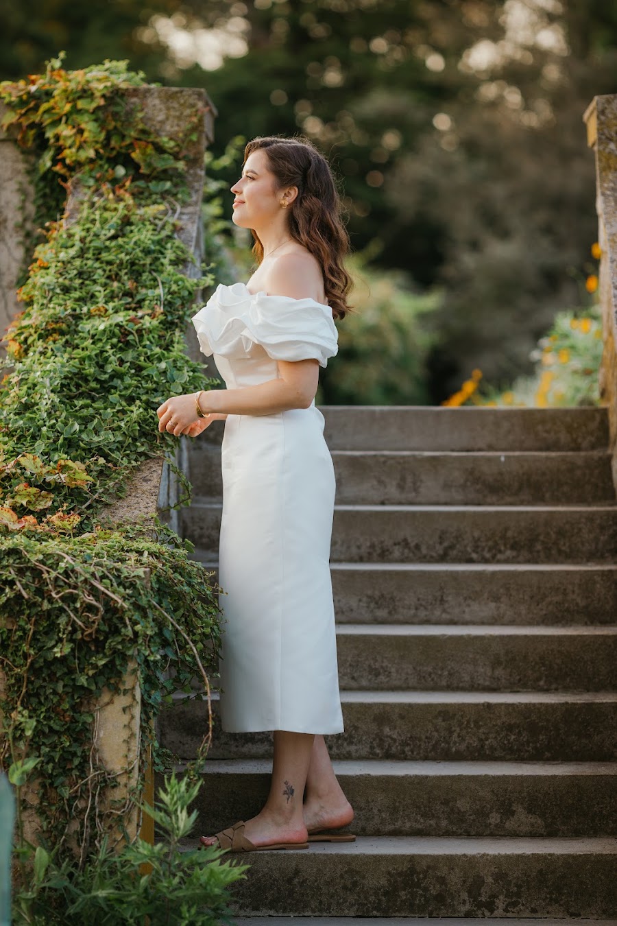 Bride on stone garden steps — New England estate wedding