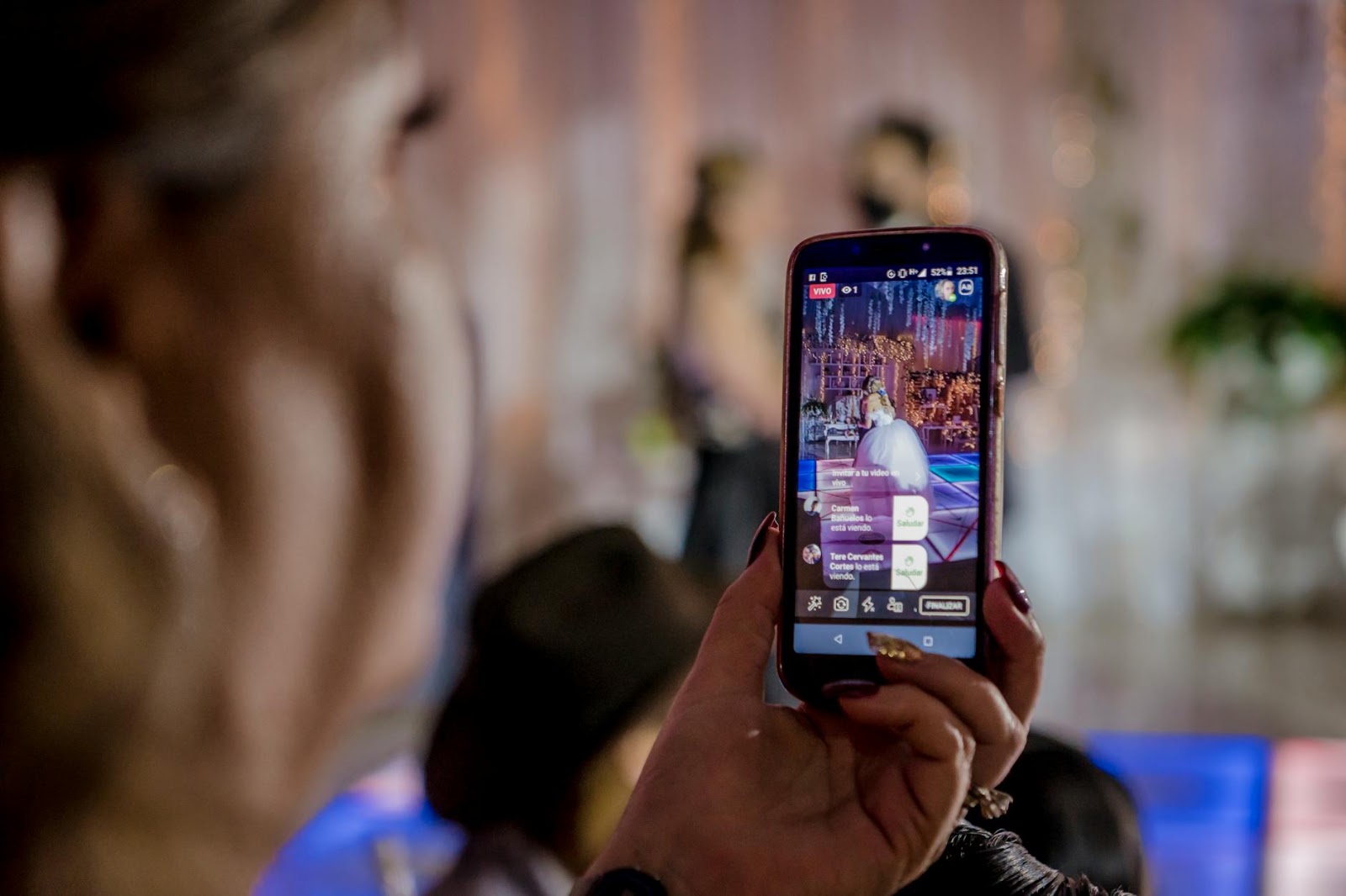 People engaging with a live stream shopping event, highlighting interaction and real-time purchases, reflecting live social media shopping trends.