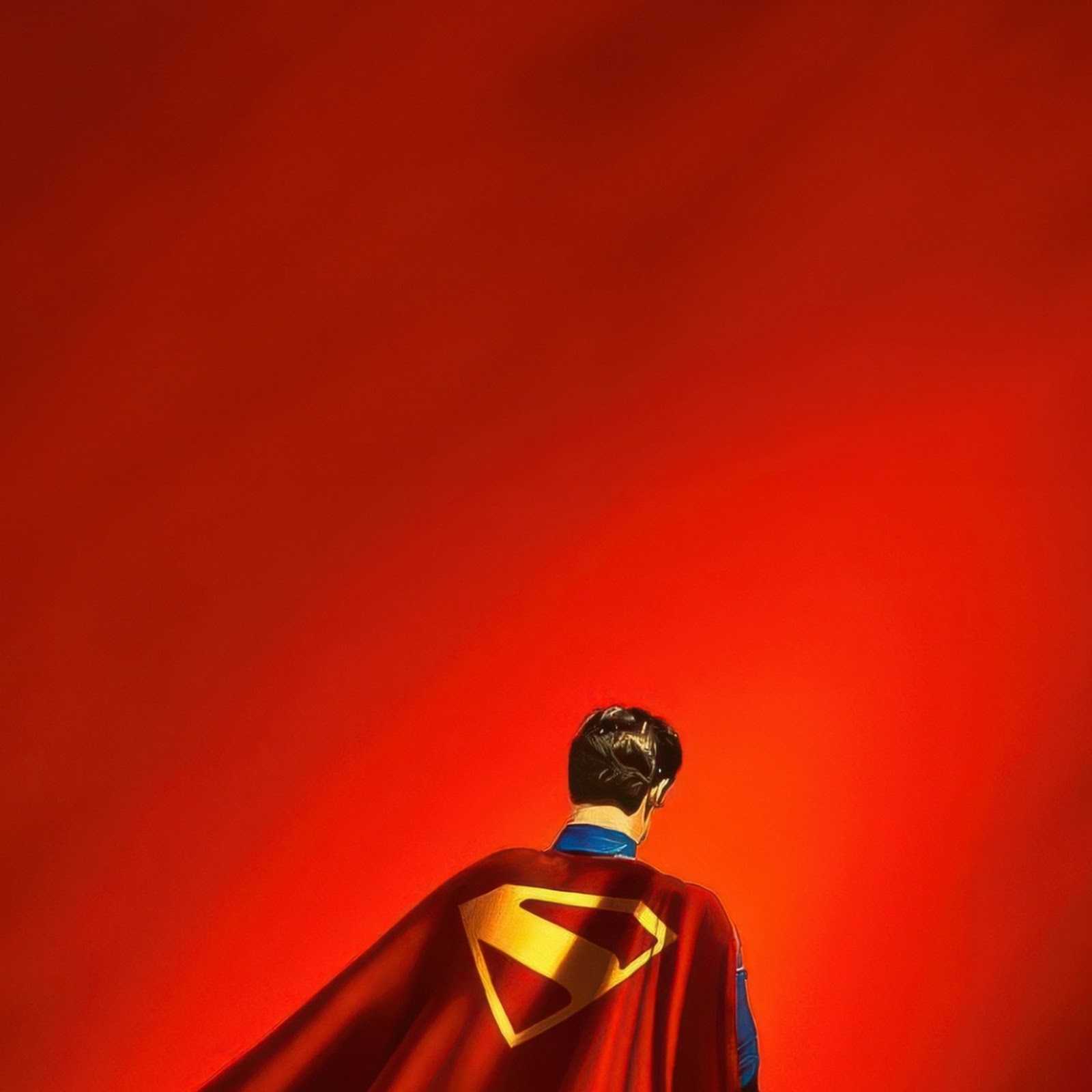 Download Superman Standing Against Red Background iPhone
