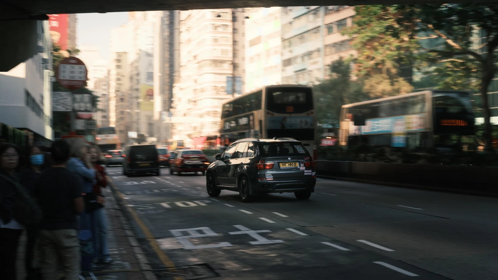BMW SUV Driving in Hong Kong - Street Photography 8K Wallpaper (7952x4473)