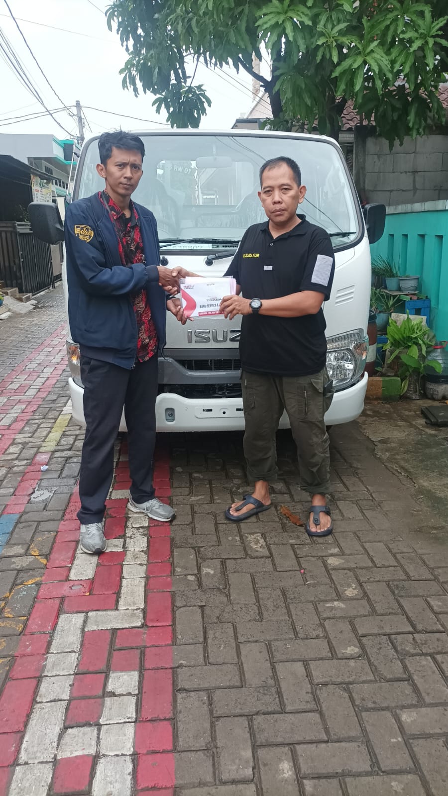 Delivery Isuzu Traga ke Garasi Konsumen