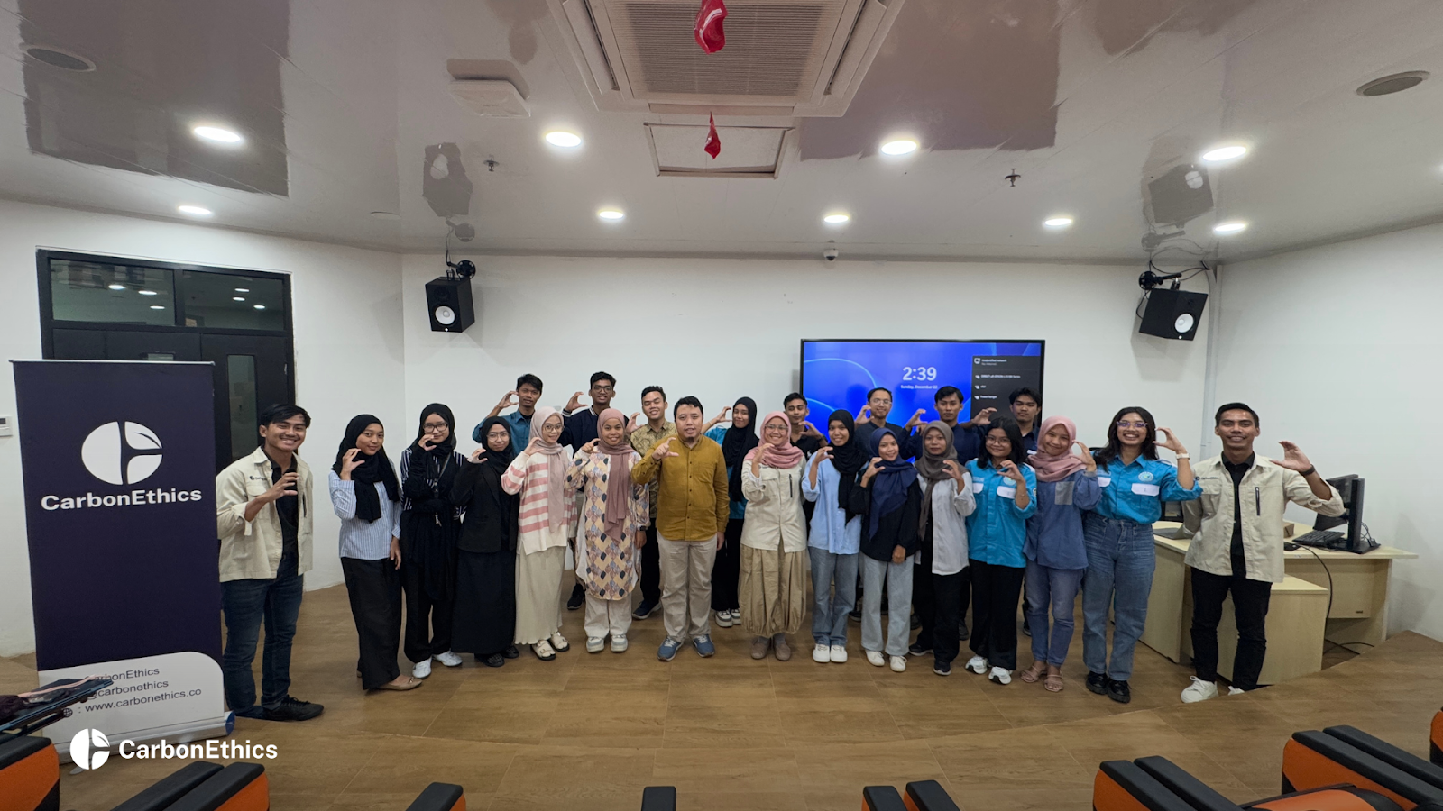 CarbonEthics and Youth Empowerment for Seagrass (SOA) are taking a group photo with faculty and students at the grand opening of the Seagrass Education Academy.