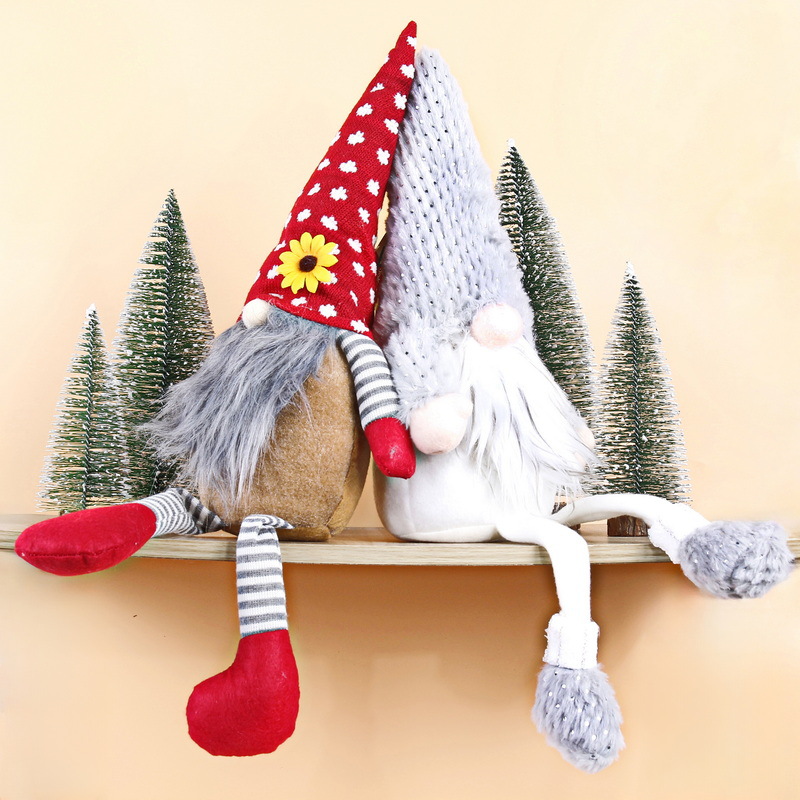 Christmas gnome figure with long legs, sitting