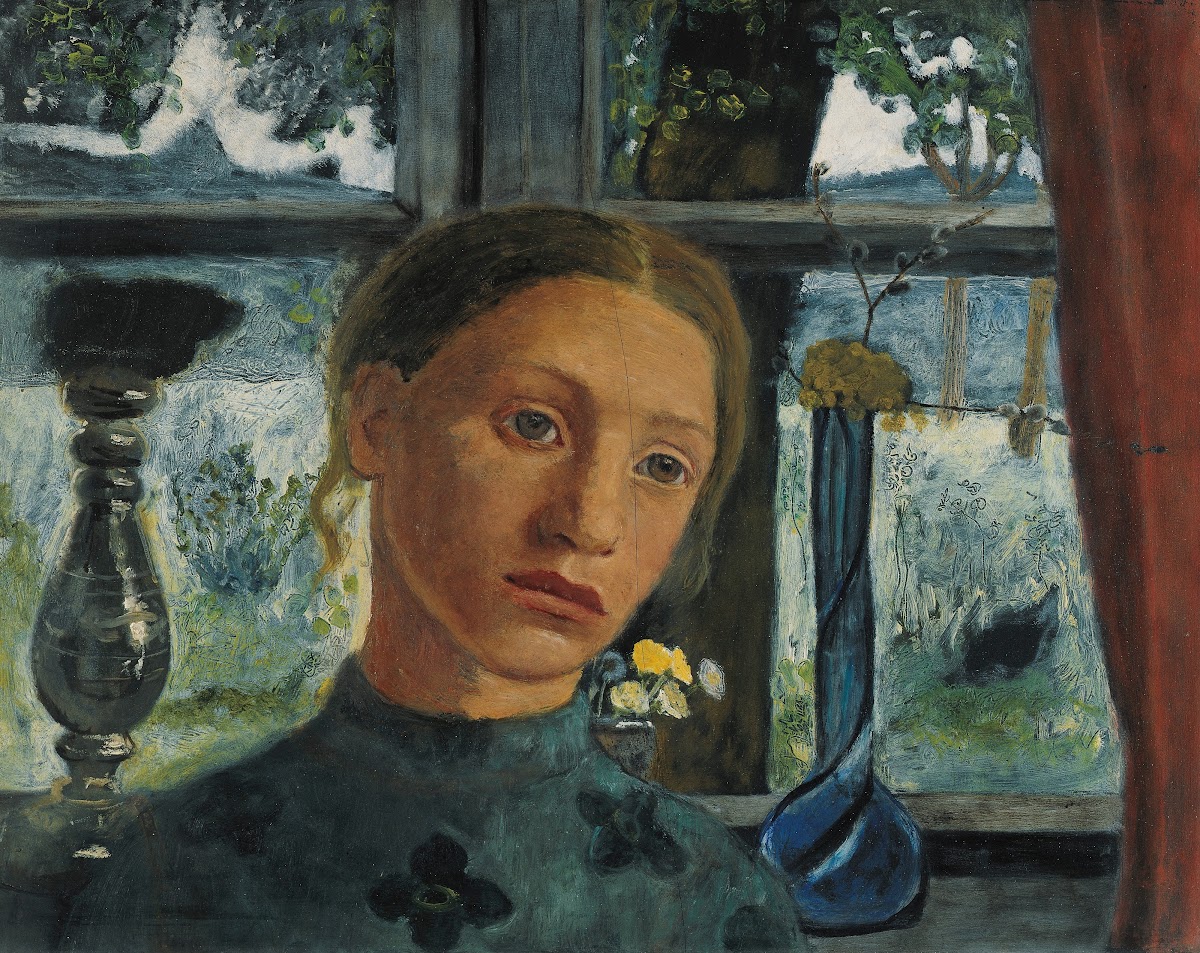 Girls head in front of a window circa 1902