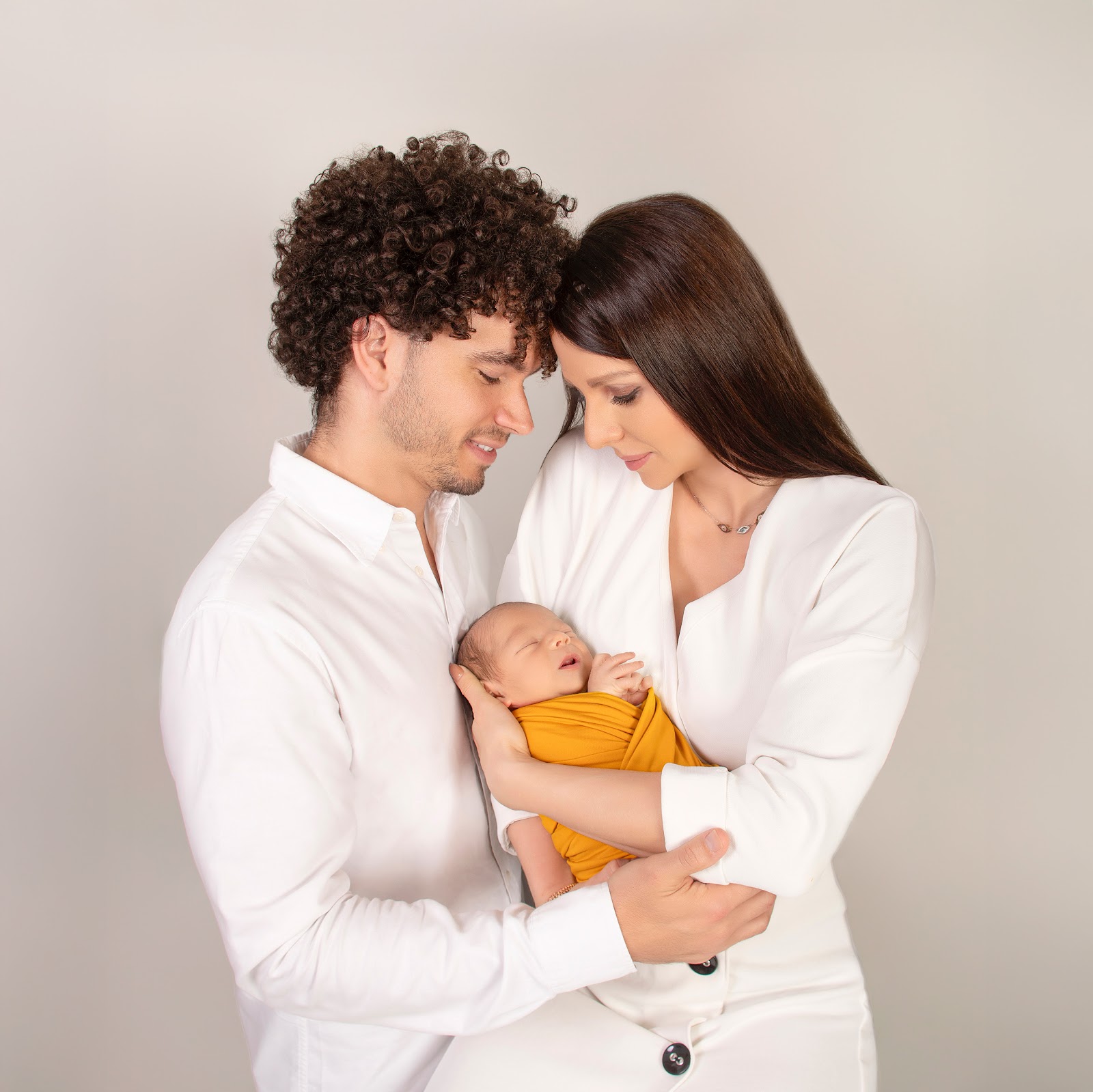 Baby and parents in studio