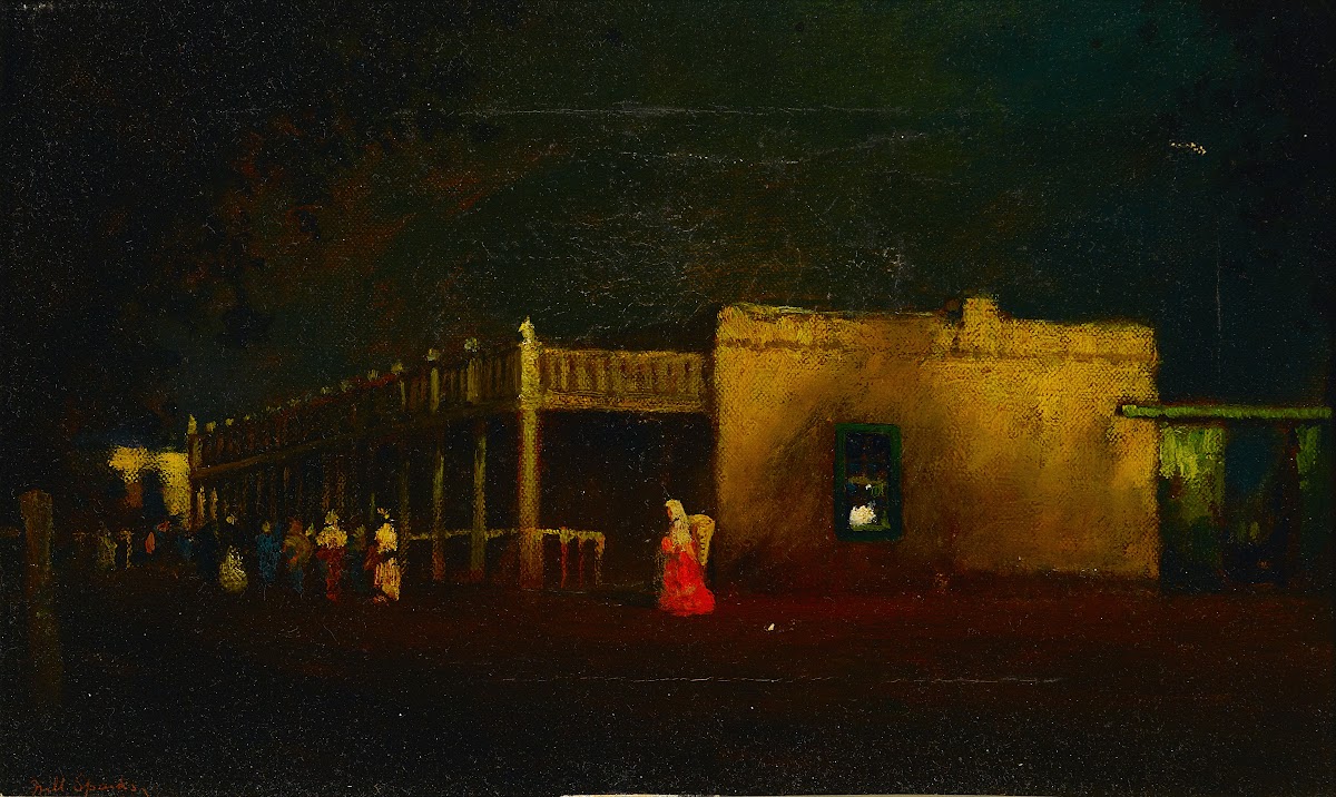 View of figures on a street by a hacienda