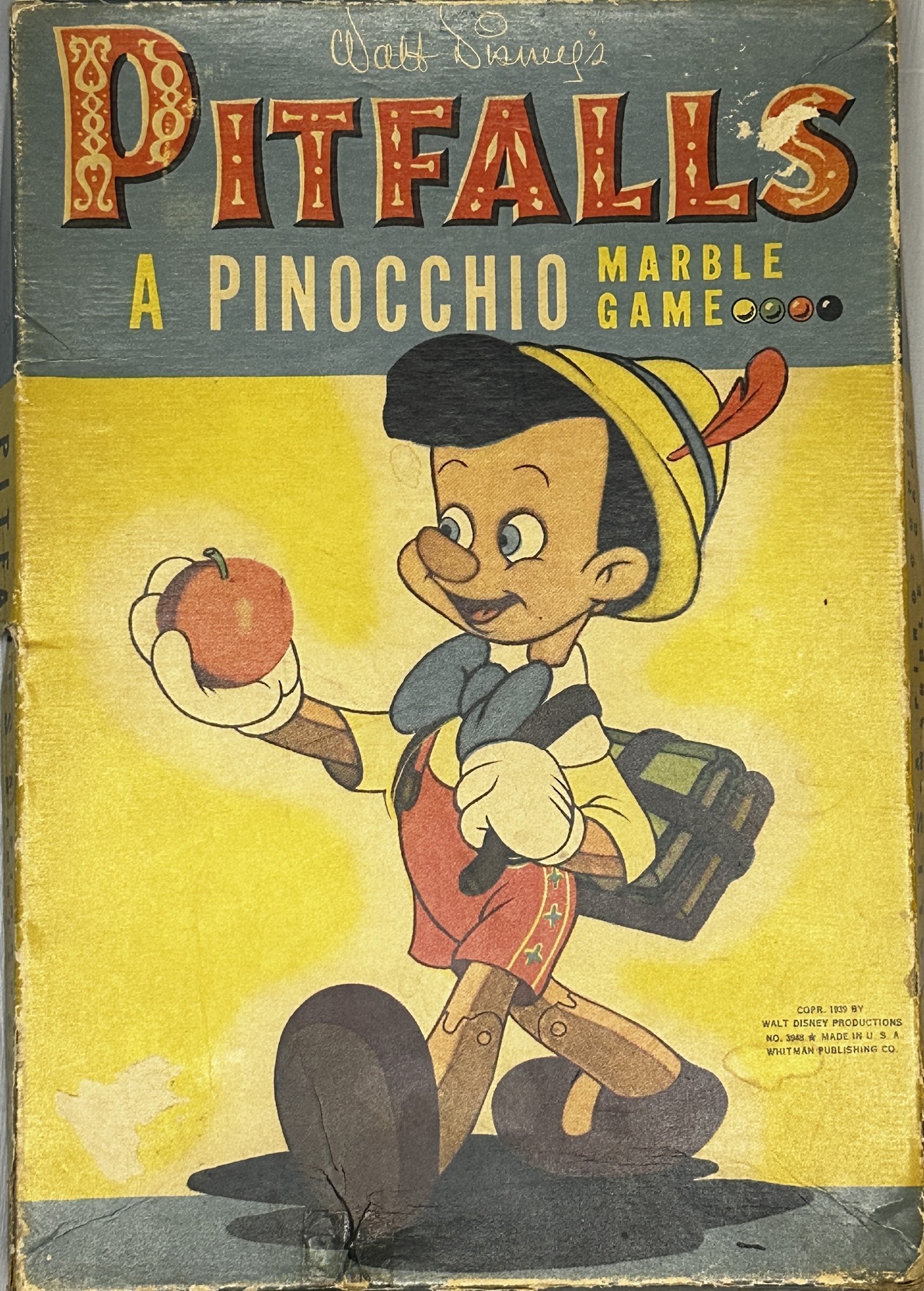 Pitfalls: A Pinocchio Marble Game by Whitman Publishing Co., 1939, with schoolboy Pinocchio artwork and Art Deco lettering
