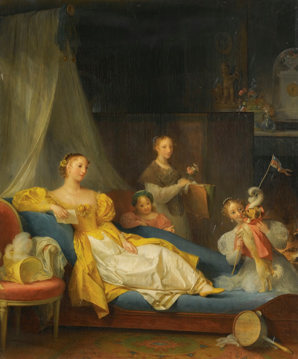 A Family In An Interior Playing With A Dog
