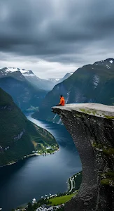 Solitude on Cliff Edge Overlooking Deep Norwegian Fjord