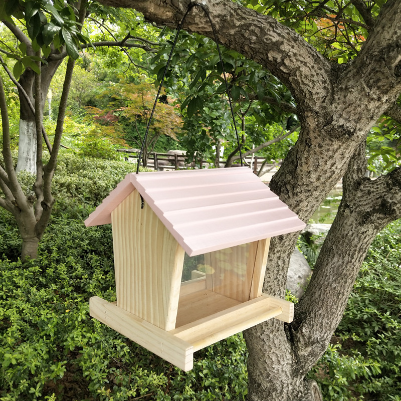 Rustic hanging bird feeder made of pine wood