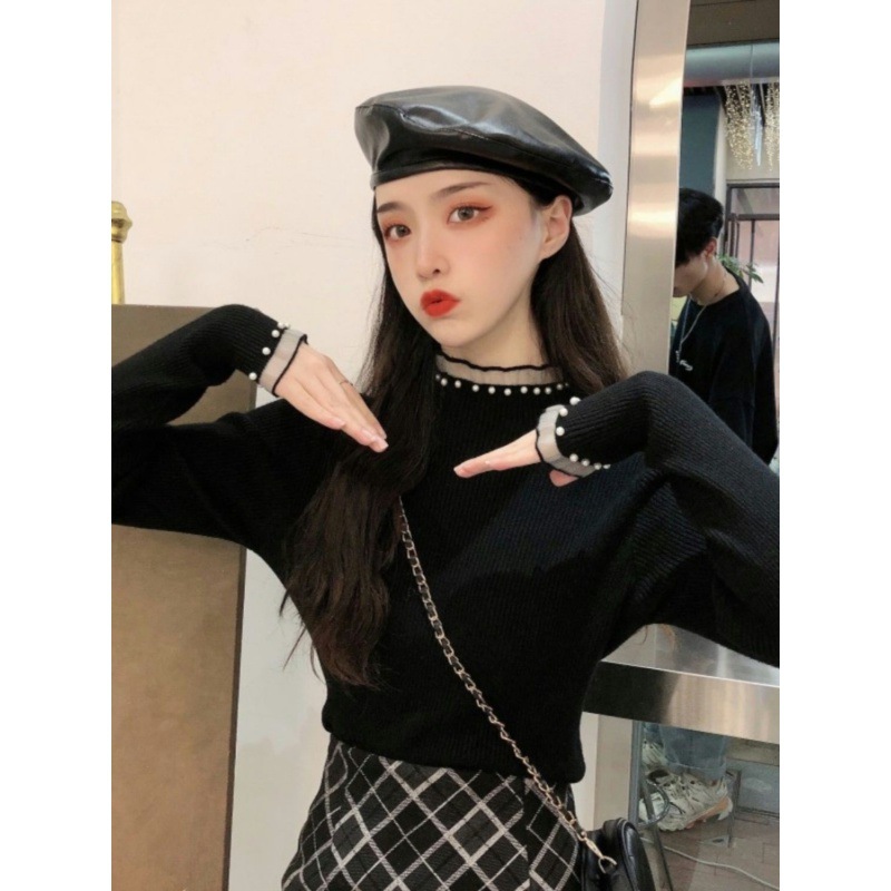 Women's knitted sweater with stand-up collar, lace, and pearls